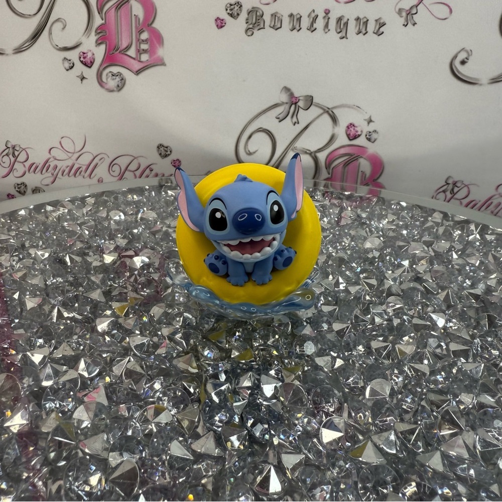 Disney Blue Stitch Figurine on Yellow Floaty  With Water Accents